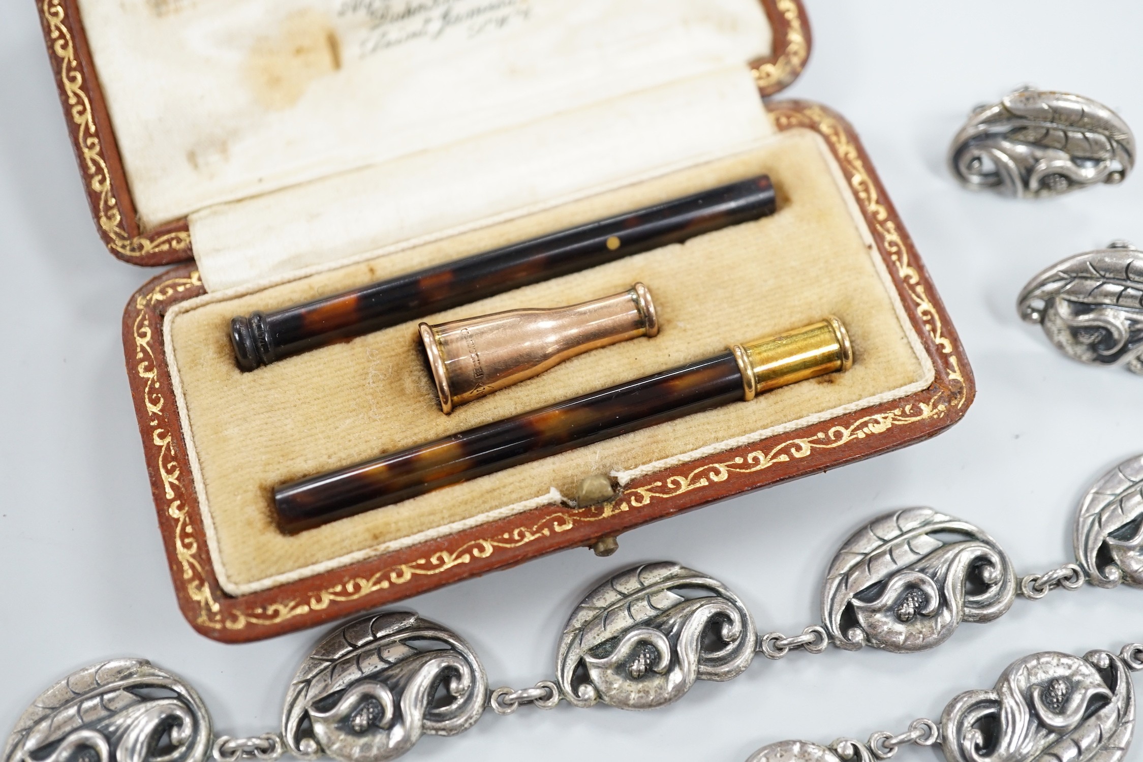 A George V 9ct gold mounted tortoiseshell cigarette holder, by Alfred Dunhill, London, 1922, in original Alfred Dunhill fitted gilt tooled leather box, 8cm, with interchangeable mouthpieces, together with a Danecraft ste